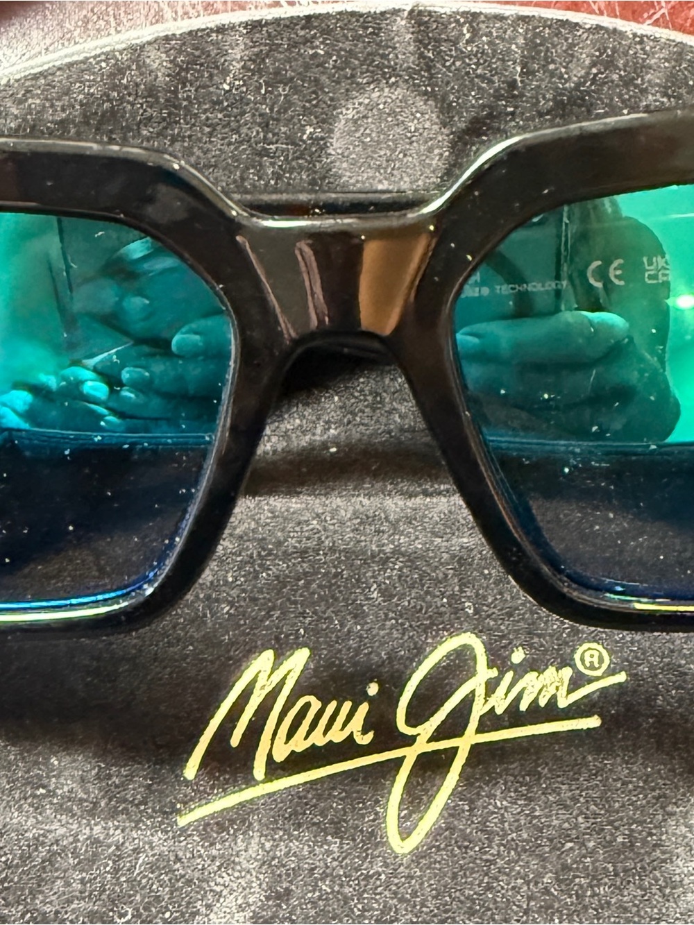 Maui Jim Black Frame Sunglasses with Teal-Blue Lenses